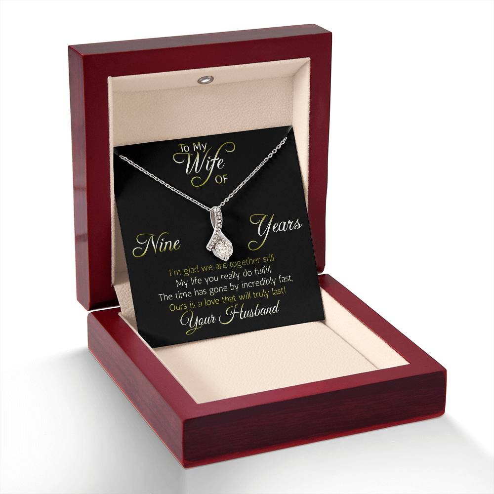 Terrific Nine years' anniversary gift: Alluring Beauty ribbon pendant reminds her that your love is forever!