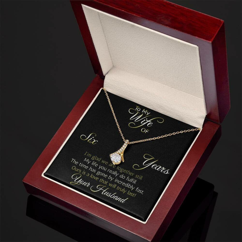 Fantastic 6 year anniversary gift: Aluring Beauty ribbon pendant reminds her that your love everlasting!