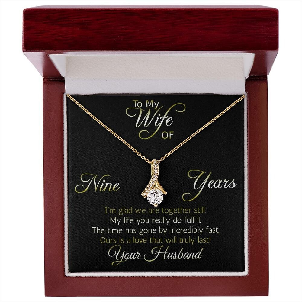 Terrific Nine years' anniversary gift: Alluring Beauty ribbon pendant reminds her that your love is forever!