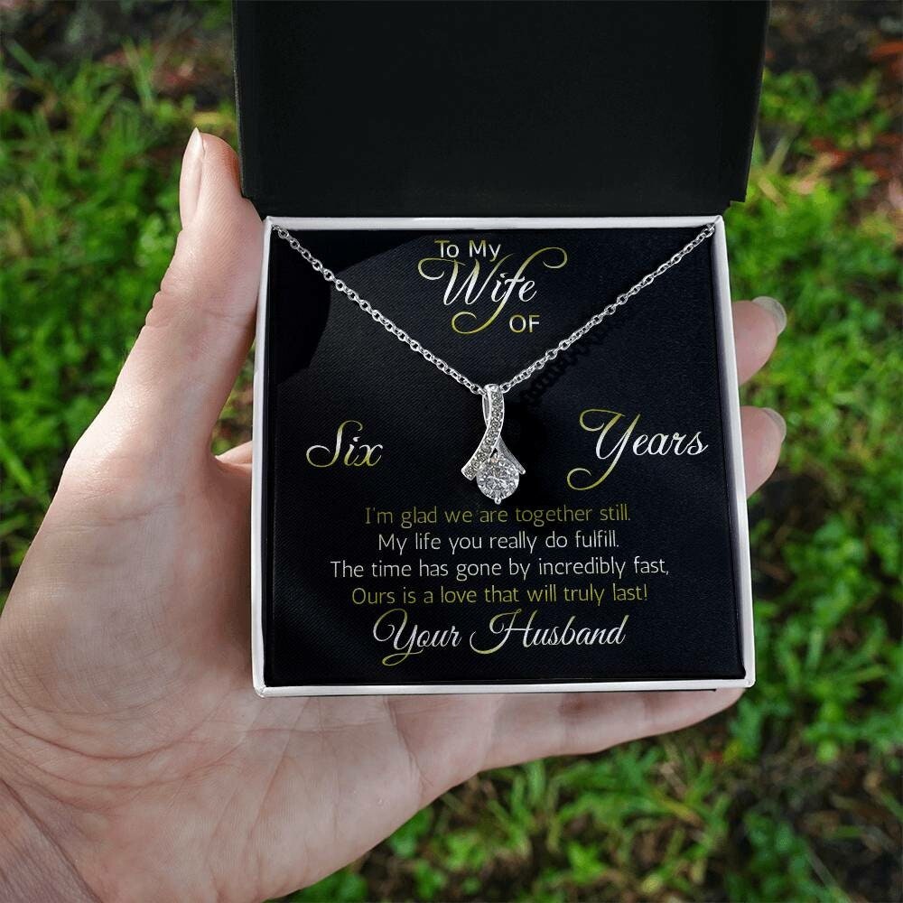 Fantastic 6 year anniversary gift: Aluring Beauty ribbon pendant reminds her that your love everlasting!