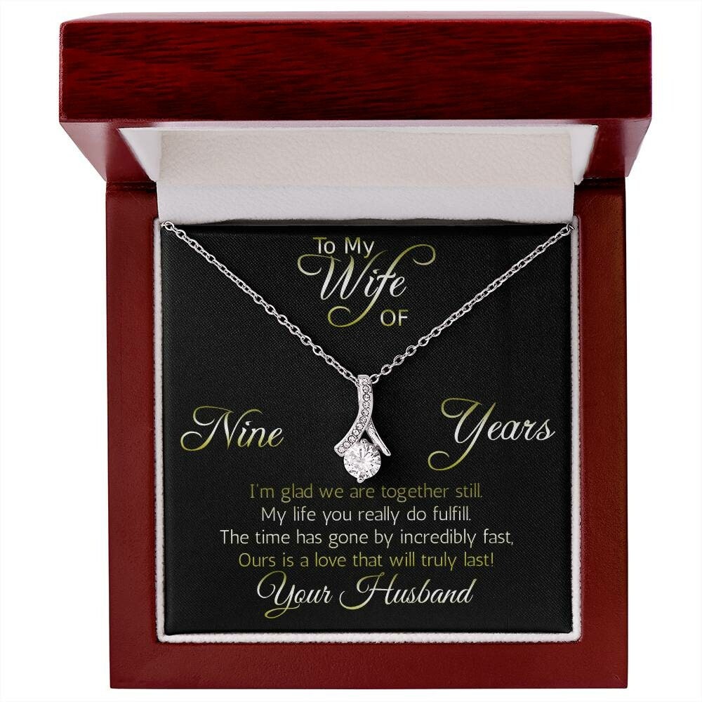 Terrific Nine years' anniversary gift: Alluring Beauty ribbon pendant reminds her that your love is forever!